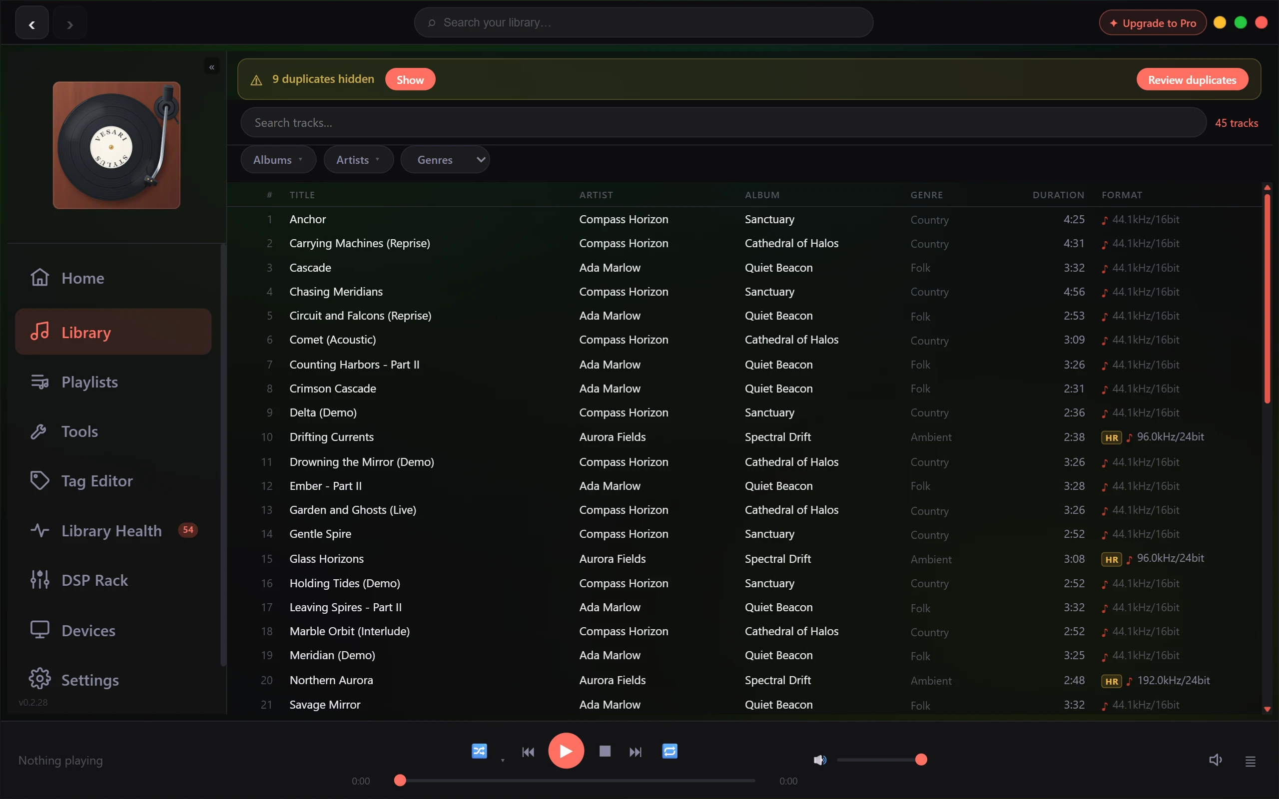 The Library track list, with title, artist, album, genre, duration and format filled in on every visible row. The format column reads values such as 44.1kHz/16bit, and a few rows carry an HR badge. A banner across the top of the page reads 9 duplicates hidden, with a Show button beside it and a Review duplicates button at the right. The count above the list reads 45 tracks.