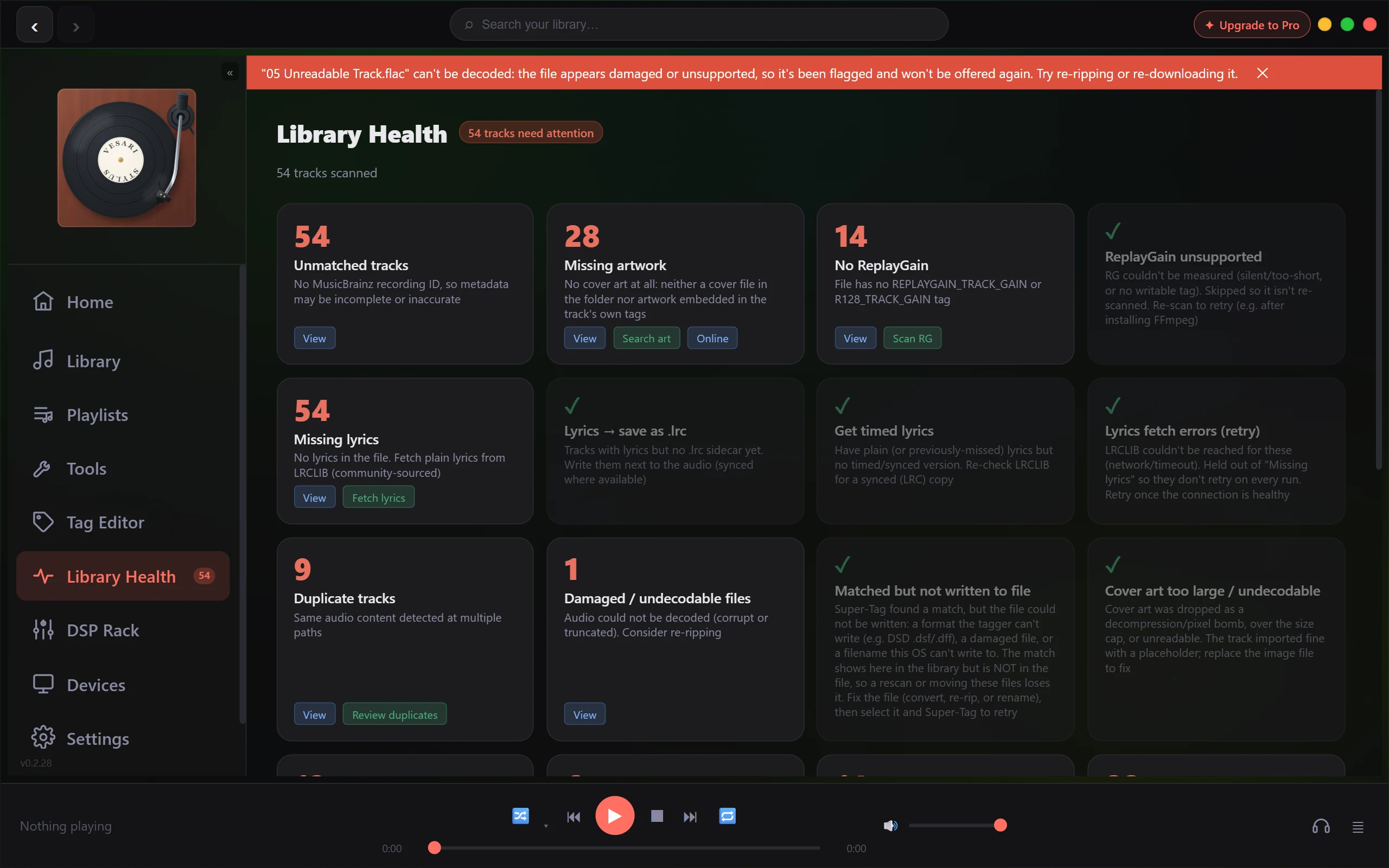 The Library Health page, with a red banner across the top saying that 05 Unreadable Track.flac cannot be decoded, that it appears damaged or unsupported, that it has been flagged and will not be offered again, and suggesting re-ripping or re-downloading. Under the banner a badge reading 54 tracks need attention sits beside the Library Health title, with 54 tracks scanned below it. The cards count 54 unmatched tracks, 28 missing artwork, 14 with no ReplayGain, 54 missing lyrics, 9 duplicate tracks, and 1 on Damaged / undecodable files, which carries a View button. Six other cards, among them ReplayGain unsupported and Matched but not written to file, show a green tick in place of a number. A further row of cards is cut off at the bottom edge, with only the top of each card in frame and no number or title readable. The sidebar entry for Library Health carries a badge of 54.